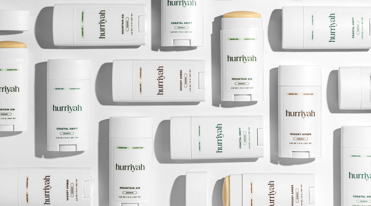 Hurriyah deodorant sticks arranged in a flat lay on white